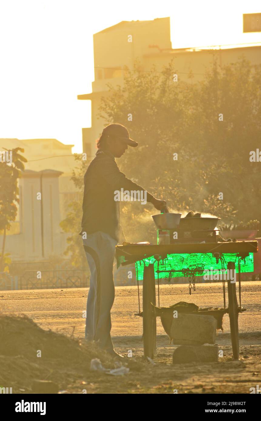 Silhouette of a street vendor Stock Photo Alamy