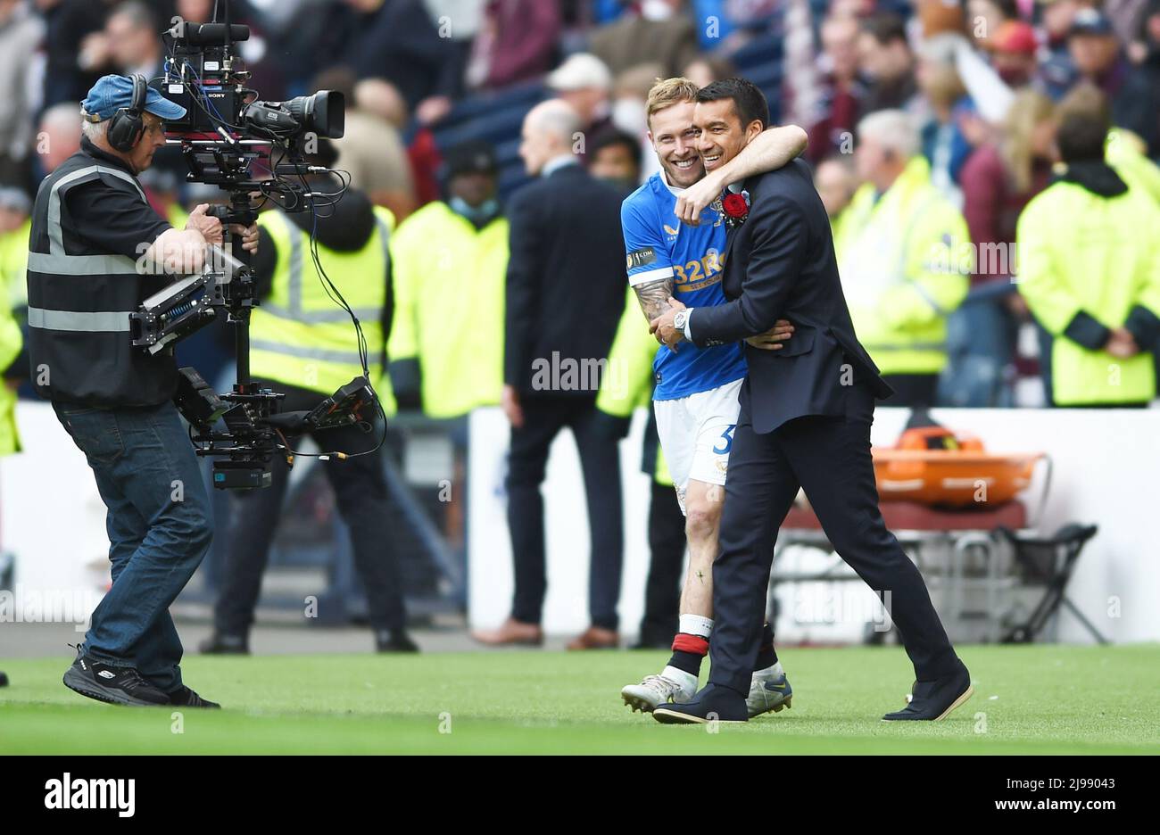 Glasgow, Scotland, 21st May 2022.  Scott Arfield and Rangers Manager Giovanni van Bronckhorst celebrates at full-time after the Scottish Cup match at Hampden Park, Glasgow. Picture credit should read: Neil Hanna / Sportimage Stock Photo