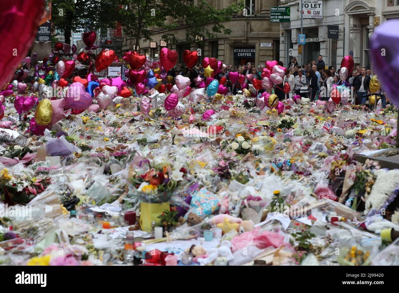 File photo dated 29/05/17 of flowers and tributes left in St Ann's Square in Manchester, folllowing the Manchester Arena terror attack by suicide bomber Salman Abedi at the end of a Ariana Grande concert in May 2017. Issue date: Saturday May 21, 2022. Stock Photo