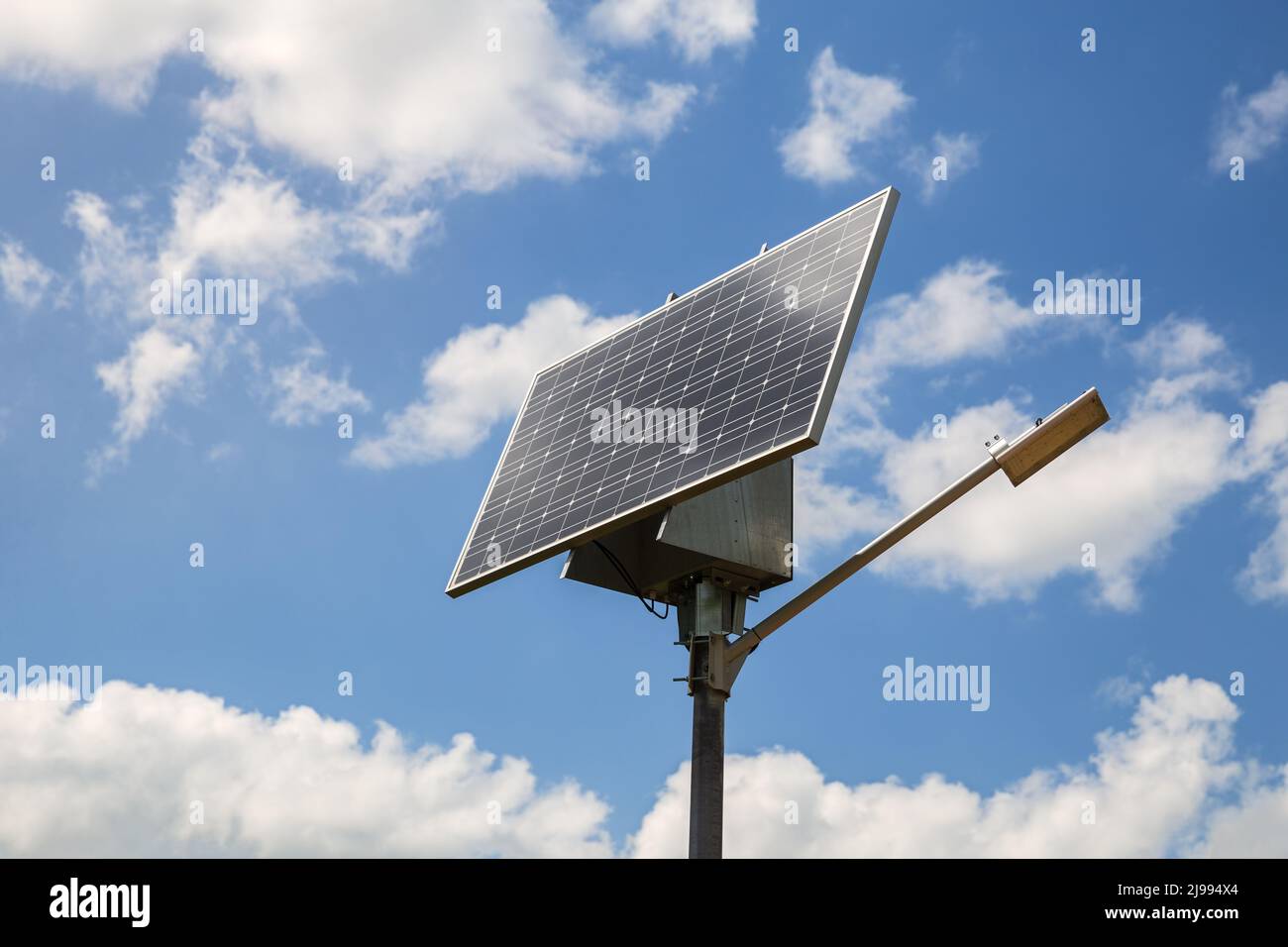 Solar-powered street lamp against the blue sky Stock Photo
