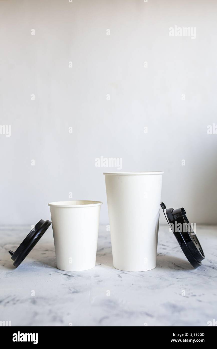 open cardboard coffee cups with lids. cardboard cups and coffee beans