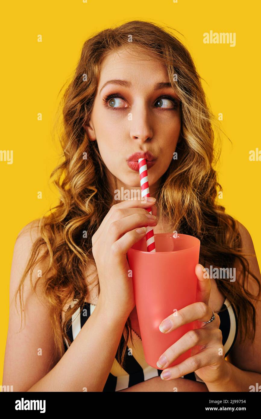 Food and drink holding face to face drinking straw hires stock