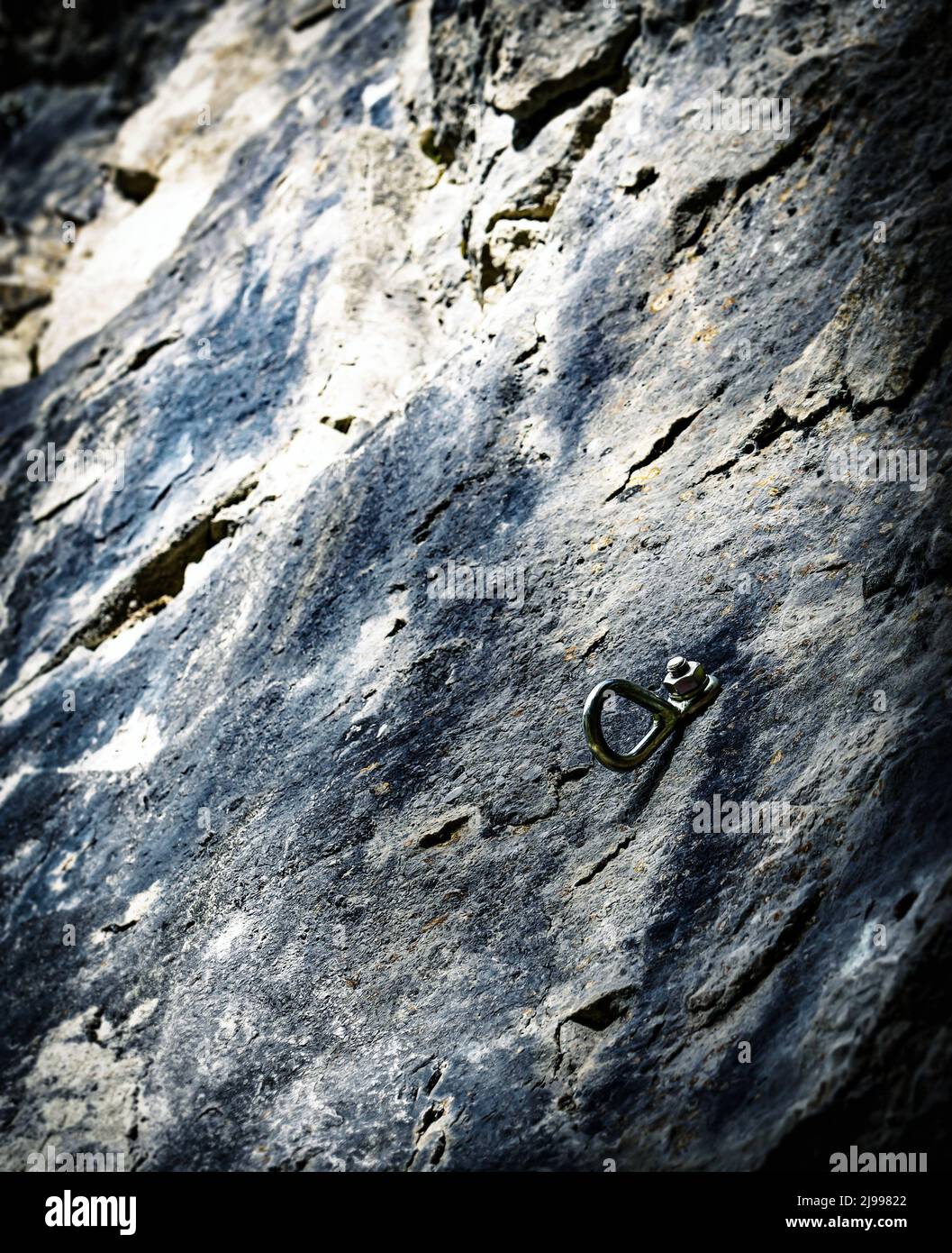 background or texture Climbing anchor security bolt in rock Stock Photo