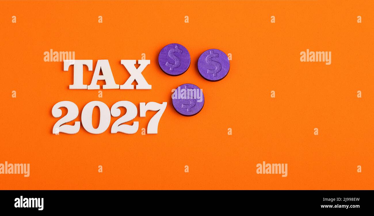 Taxes For The Year 2027 Concept White Numbers On Orange Background Taxes For The Year 2027 Concept White Numbers On Orange Background