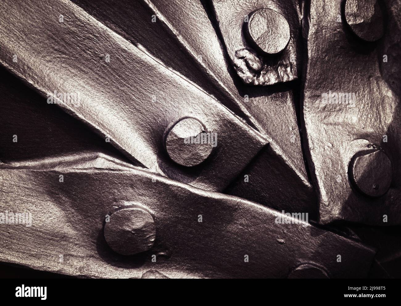 abstract background dark riveted joints wrought iron Stock Photo