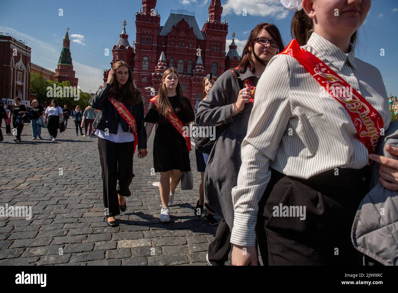 Moscow, Russia. 21st May, 2022. School leavers walk on Red Square to celebrate Farewell Bell Day traditionally marking the end of classes before the final exams in Moscow, Russia Stock Photo