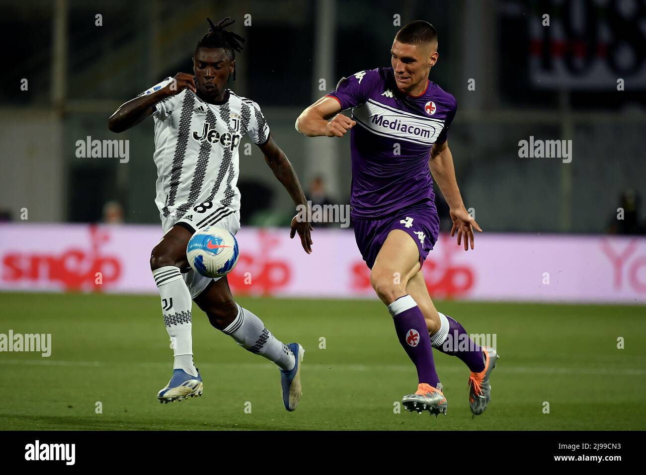 Florence, Italy. 21st May, 2022. Moise Kean of Juventus FC and Nikola  Milenkovic of ACF Fiorentina compete for the ball during the Serie A  2021/2022 football match between ACF Fiorentina and Juventus