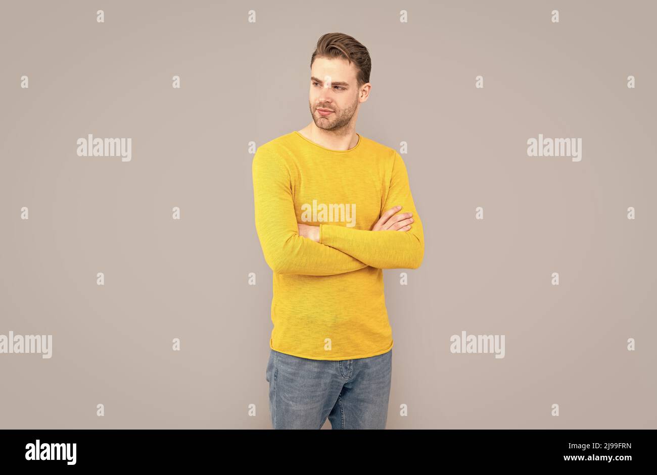 Put on confidence. Confident man grey background. Fashion man keep arms crossed Stock Photo