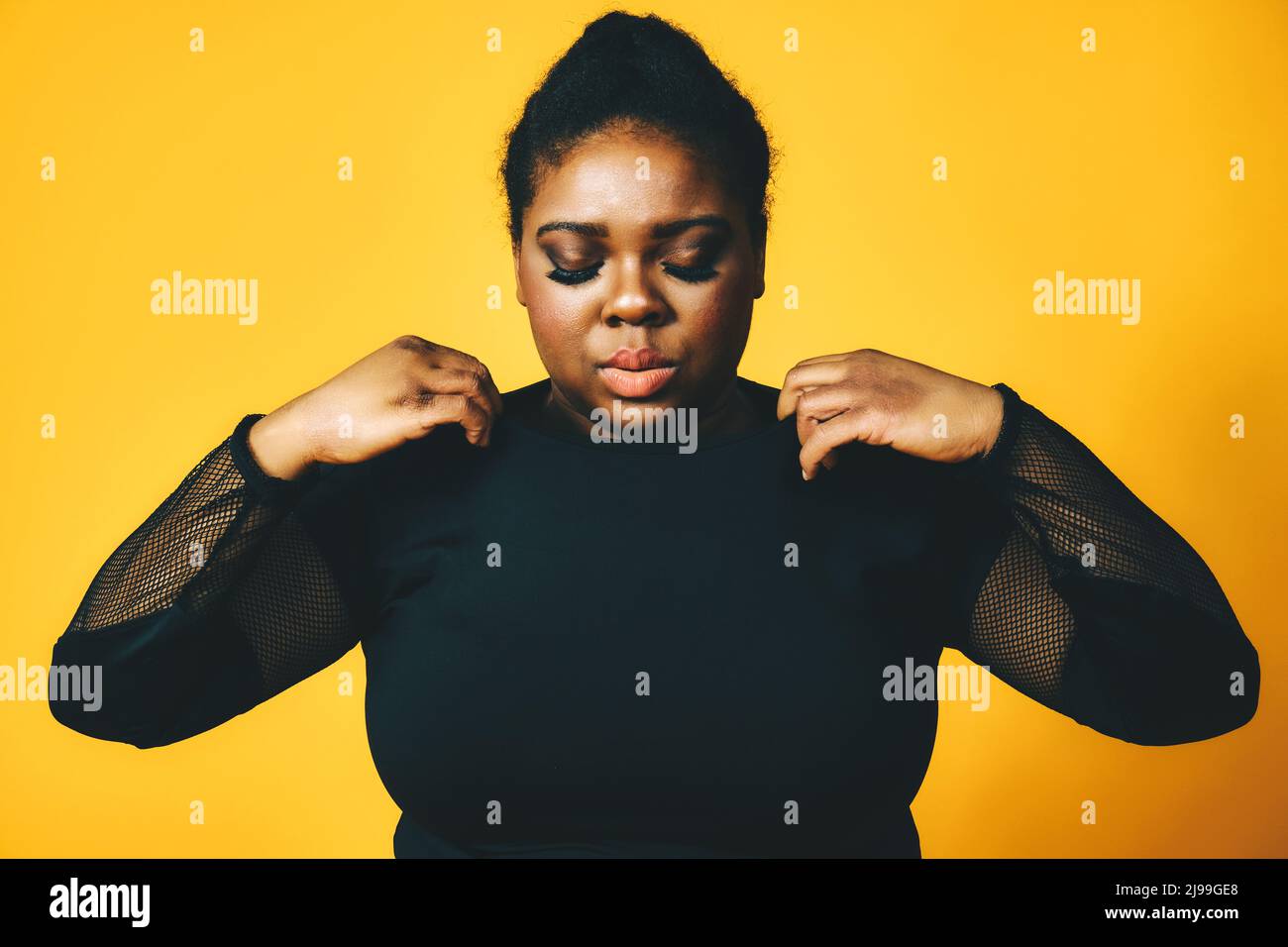 closeup portrait of a thoughtful black woman with crossed arms on ...