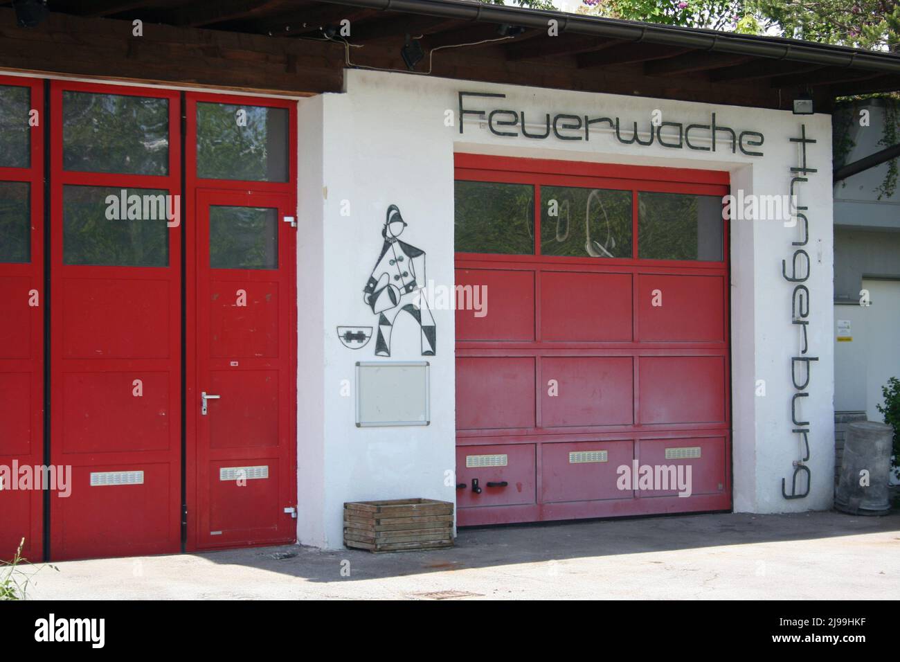 Innsbruck, Austria - May 8, 2014 - local fire station with bright red doors. Stock Photo
