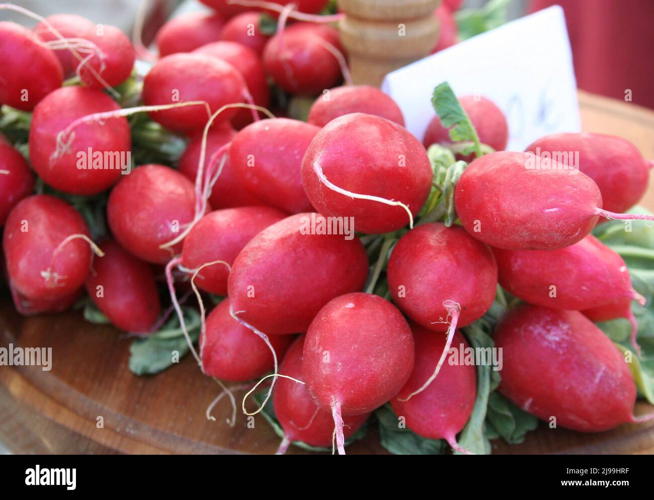 Beautiful bright red radishes at a farmer's market, Germany. Stock Photo
