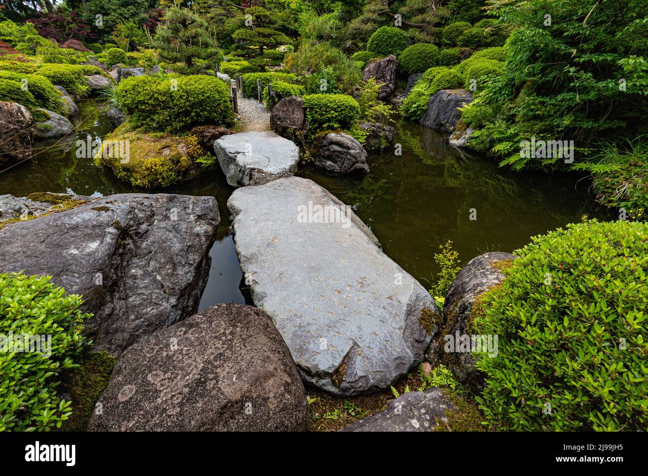 Hisuien Jade Garden  - A 70 ton boulder of cobalt jade greets you as you enter the gate to this beautifully-landscaped Japanese garden. The site area Stock Photo