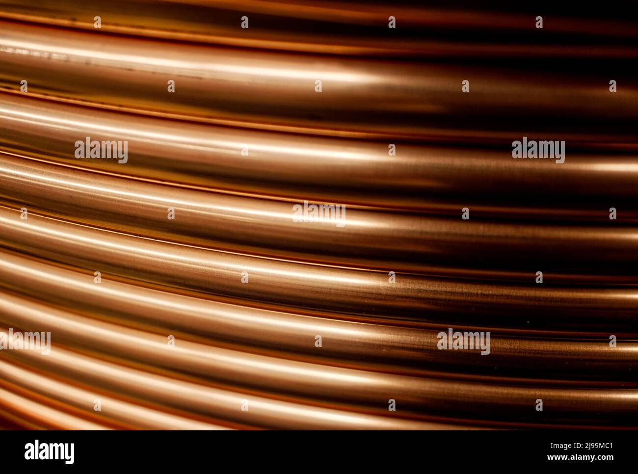 Shiny copper pipes, abstract artistic background Stock Photo Alamy