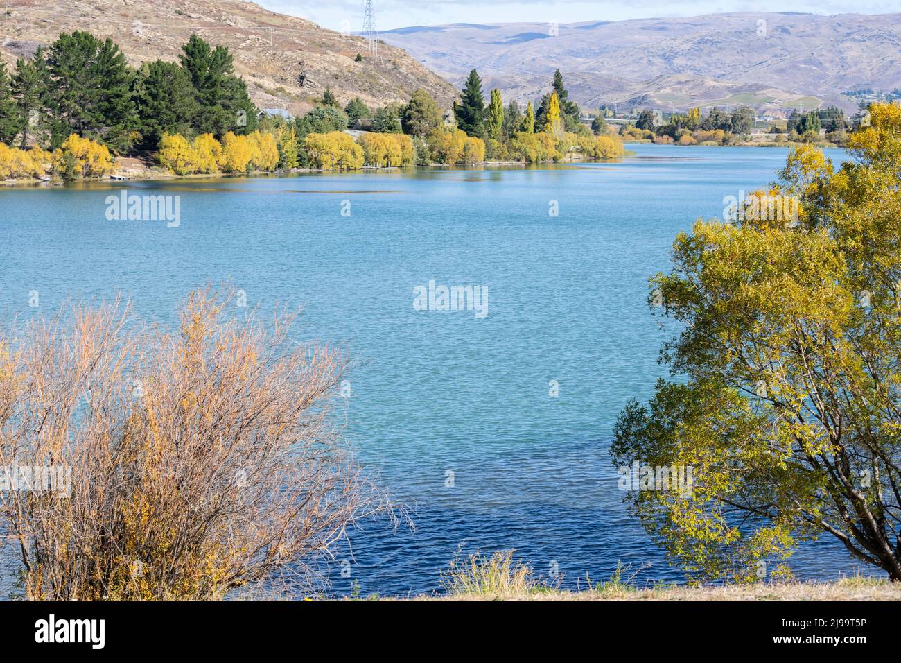 Scenic Lake Dunstan and surrounds in autumn colours at Cromwell South Island New Zealand. Stock Photo
