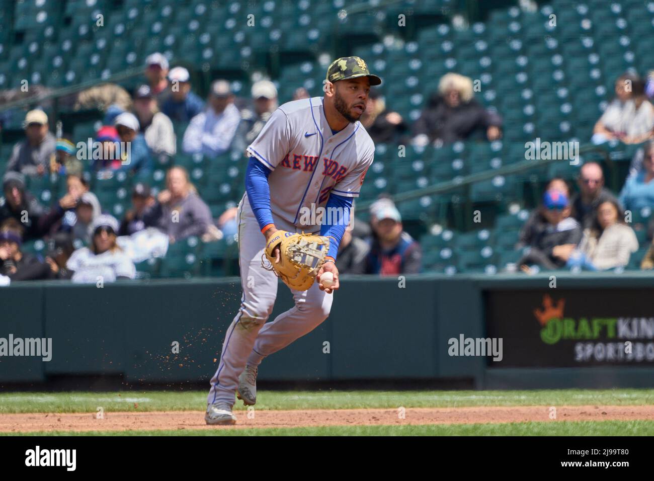 Denver CO, USA. 21st May, 2022. New York first baseman Dominic Smith (2)  makes a play during the first game of the day night double header with New  York Mets and Colorado