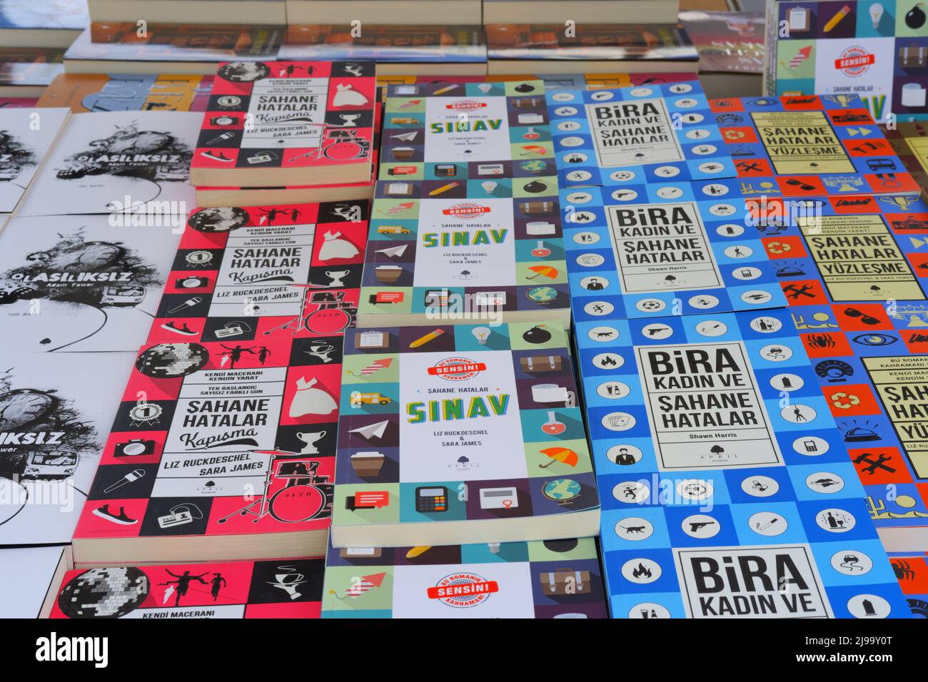 Books in Turkish displayed on table for sale at a book fair Stock Photo