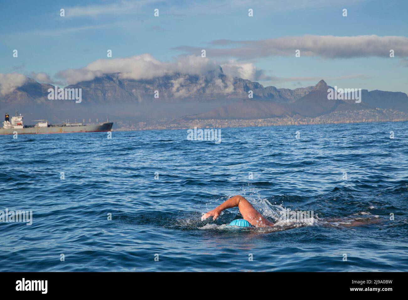 (220522) -- CAPE TOWN, May 22, 2022 (Xinhua) -- South African man Howard Warrington swims in the sea from Robben Island to the shore in Cape Town, South Africa, on May 21, 2022. South African man Howard Warrington on Saturday morning completed his 100th sea crossing from famous Robben Island to the shore in Cape Town, to raise funds for Cape of Good Hope SPCA (Society for the Prevention of Cruelty to Animals), an animal welfare organization. (photo by Francisco Scarbar/Xinhua) Stock Photo