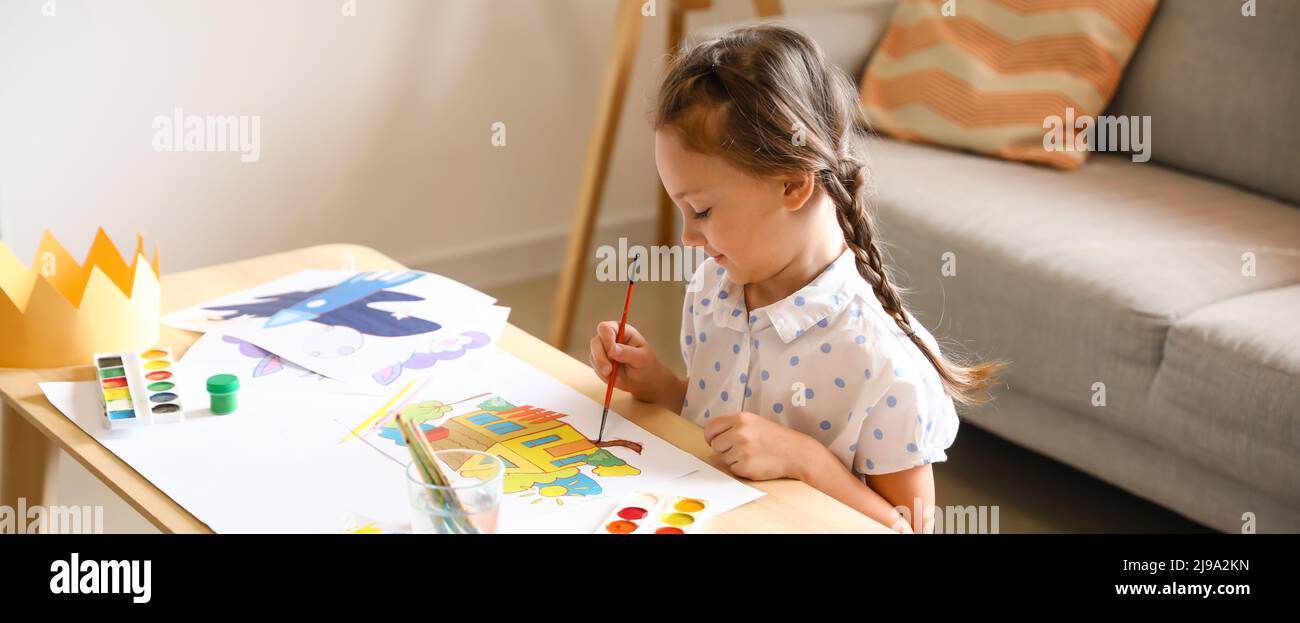 Cute little girl painting at home Stock Photo - Alamy