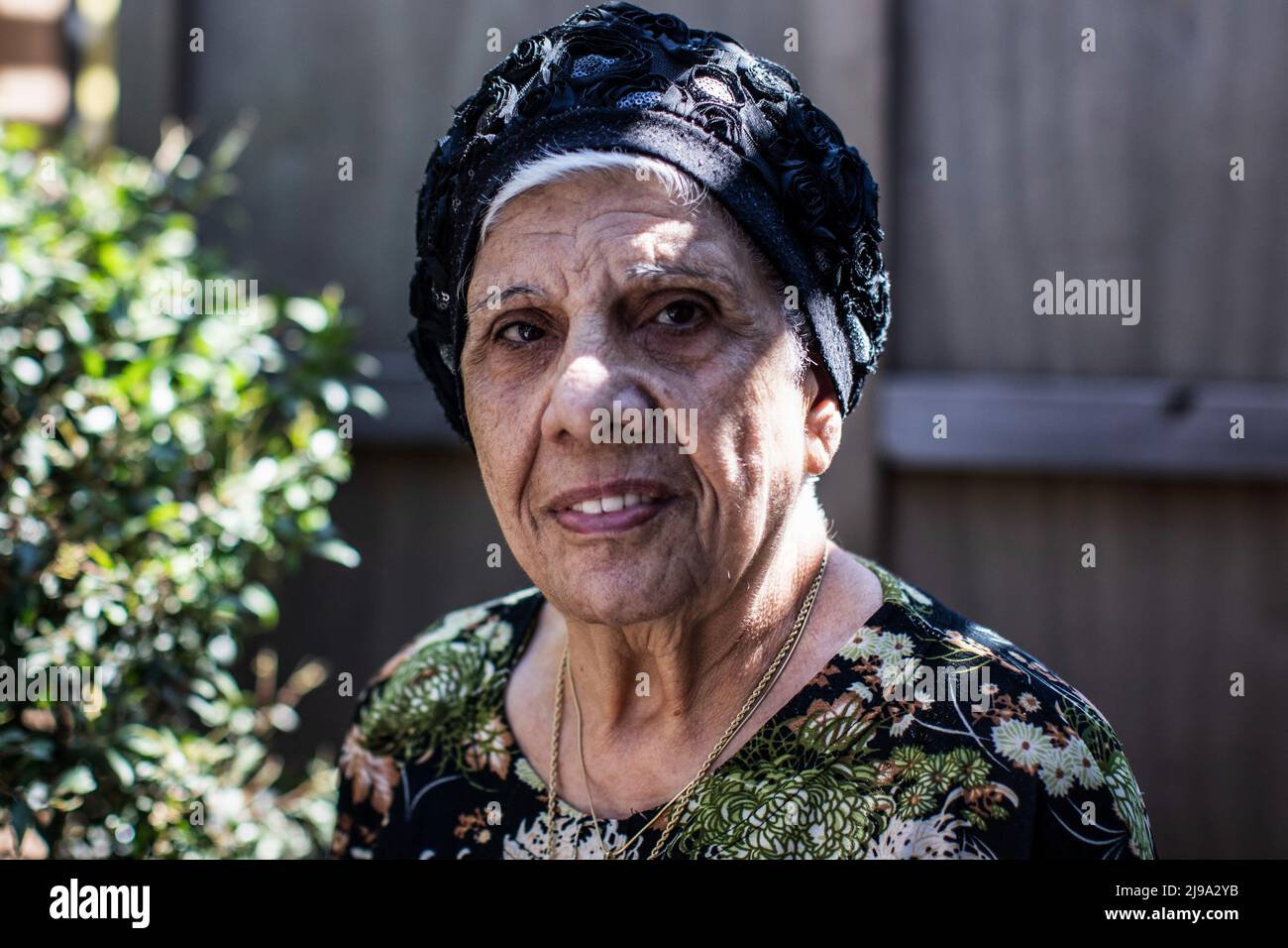 18 May 2022, Israel, Kiryat Bialik: Chaja Masus stands in the garden of her house. Her parents had come to Haifa from the Tunisian island of Djerba with their eight children in 1948. The affair of disappeared children of Jews from Yemen and other oriental countries is one of the most painful in Israeli history. In the search for the truth, the grave of her brother Usiel, born in 1952 and died in 1953, is now to be opened on Monday. The boy had contracted polio at the age of 10 months. For the follow-up treatment, the parents, who at that time already had three other children besides Usiel, had Stock Photo