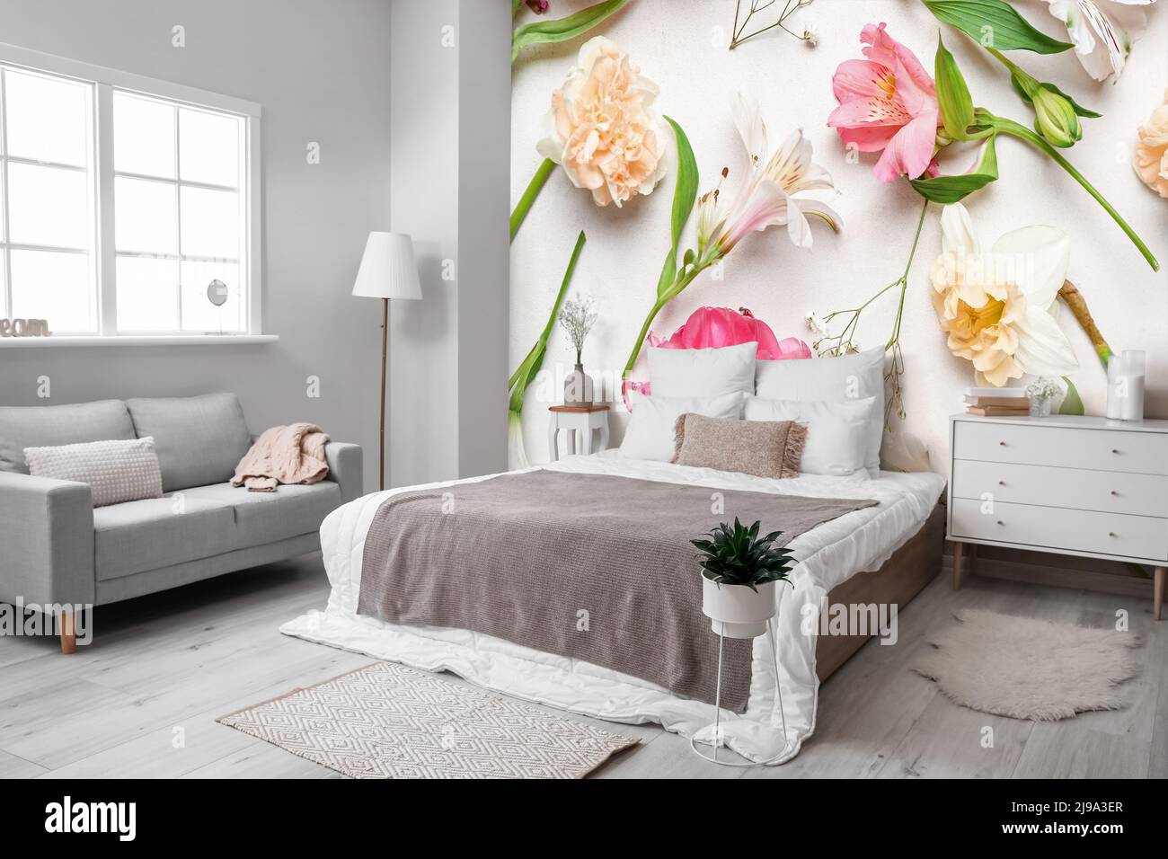 Stylish interior of modern bedroom with printed beautiful flowers on ...