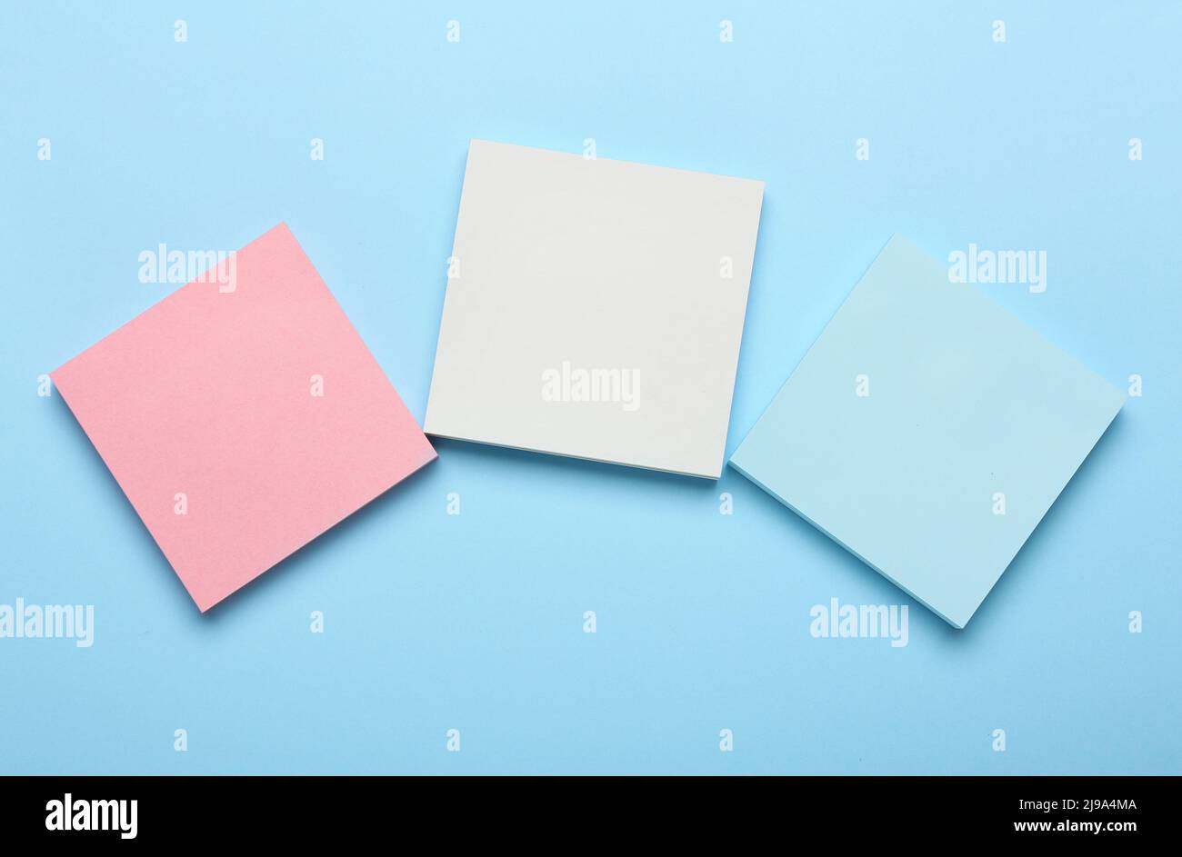 Different blank sticky notes on color background Stock Photo