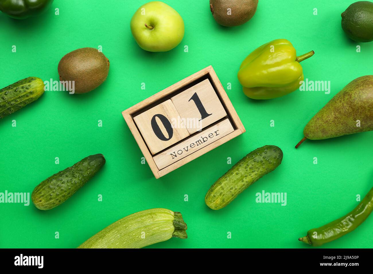 Vegetables, fruits and wooden cube calendar with date NOVEMBER 1 on