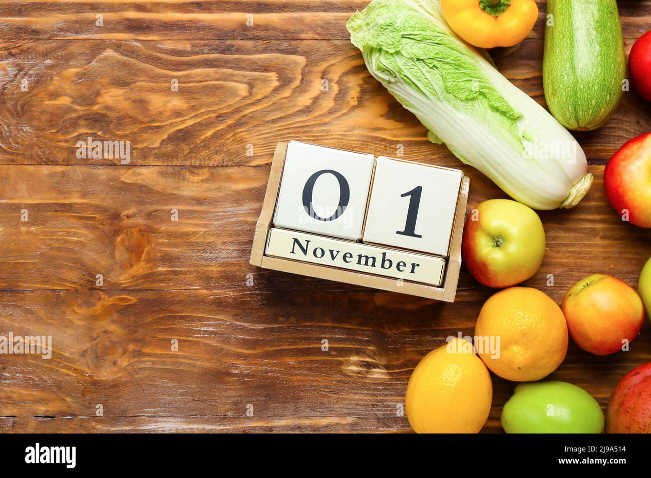 Fresh vegetables, fruits and cube calendar with date NOVEMBER 1 on