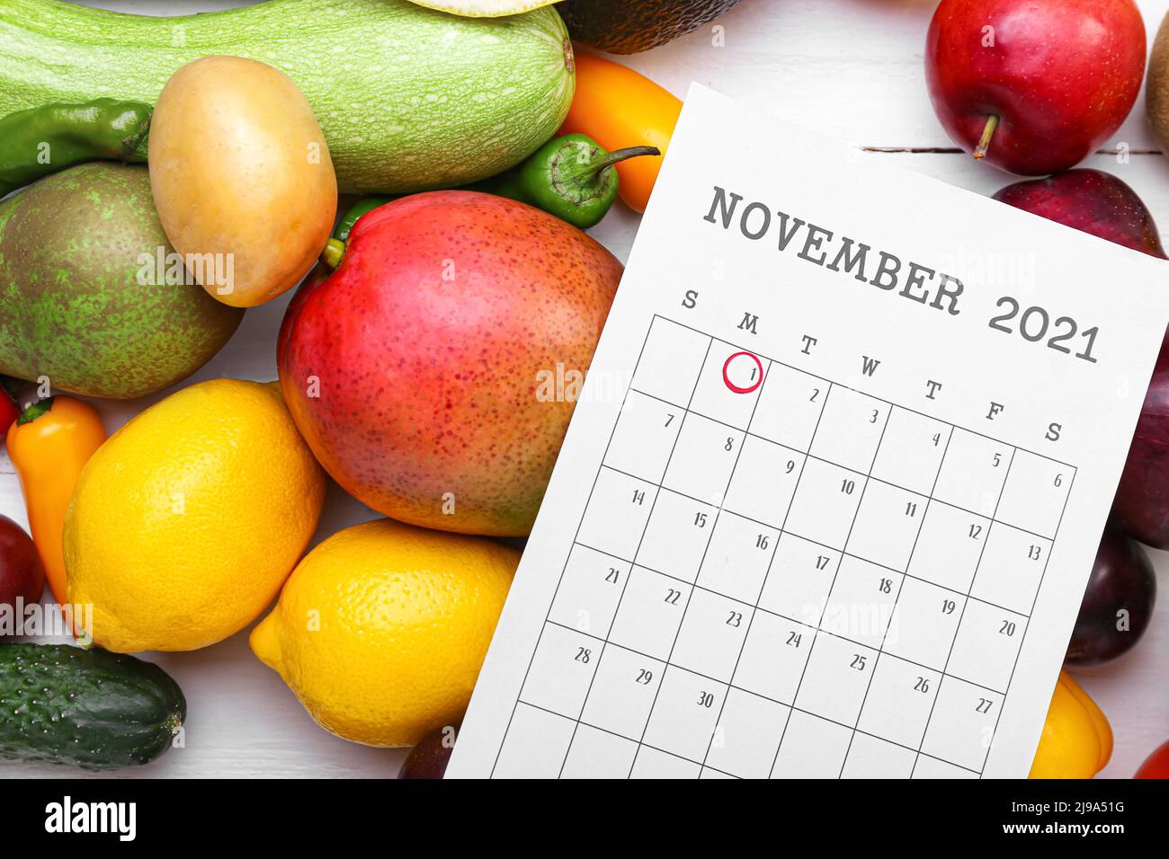 Different fruits, vegetables and calendar with marked date of World