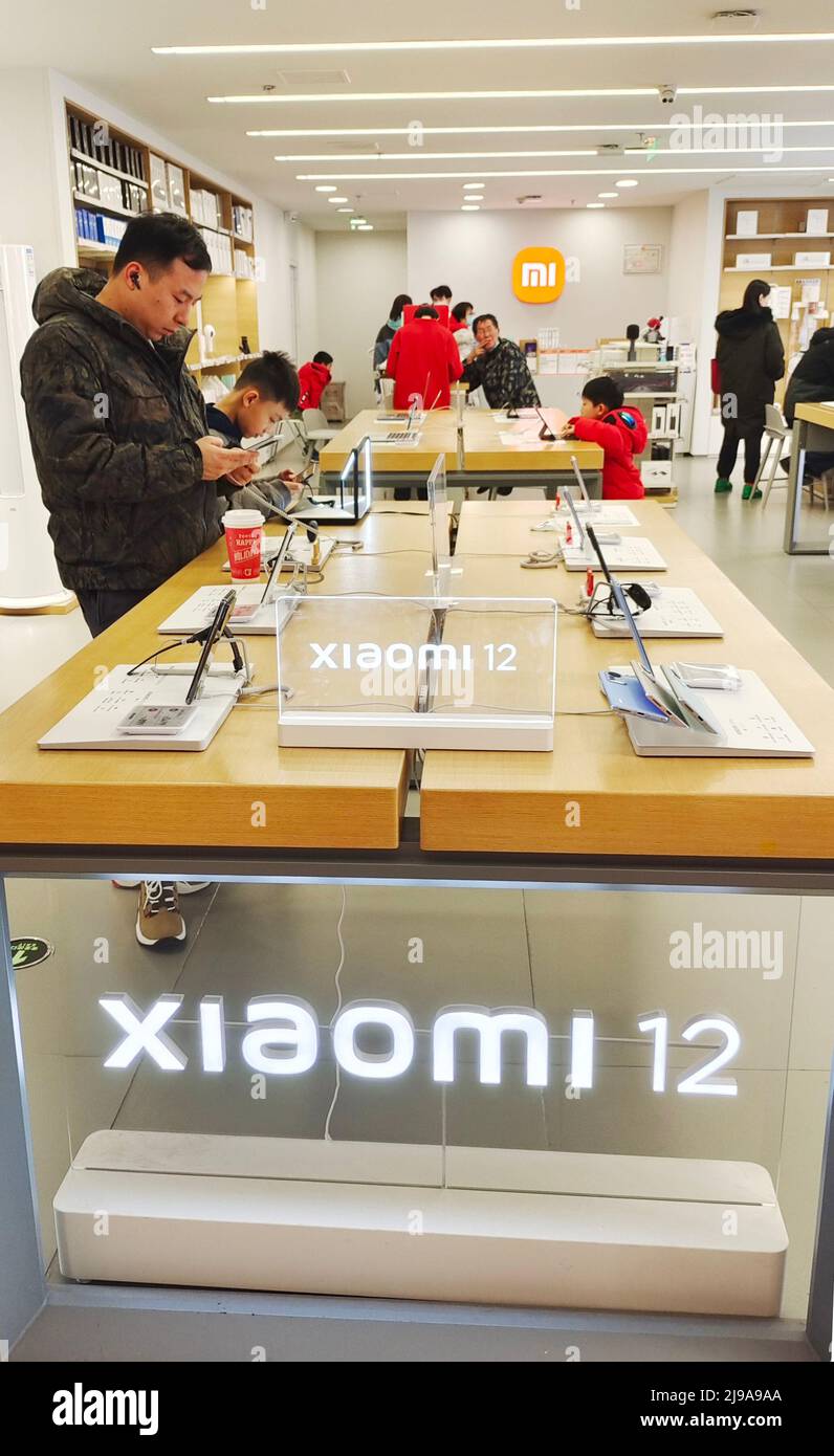 SHANGHAI, CHINA - JANUARY 16, 2022 - Customers shop at a MIi mobile phone store in Shanghai, China, Jan. 16, 2022. May 20, 2022 news, Xiaomi Group rel Stock Photo