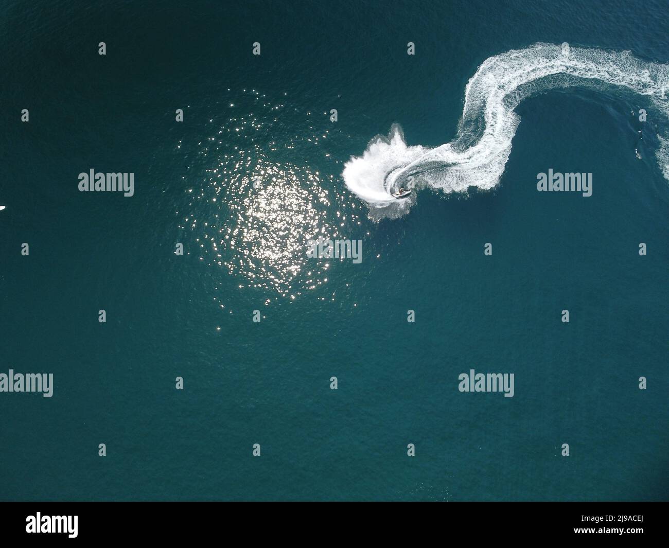 Aerial top down view of water foam trace with nice deep blue shade of ...