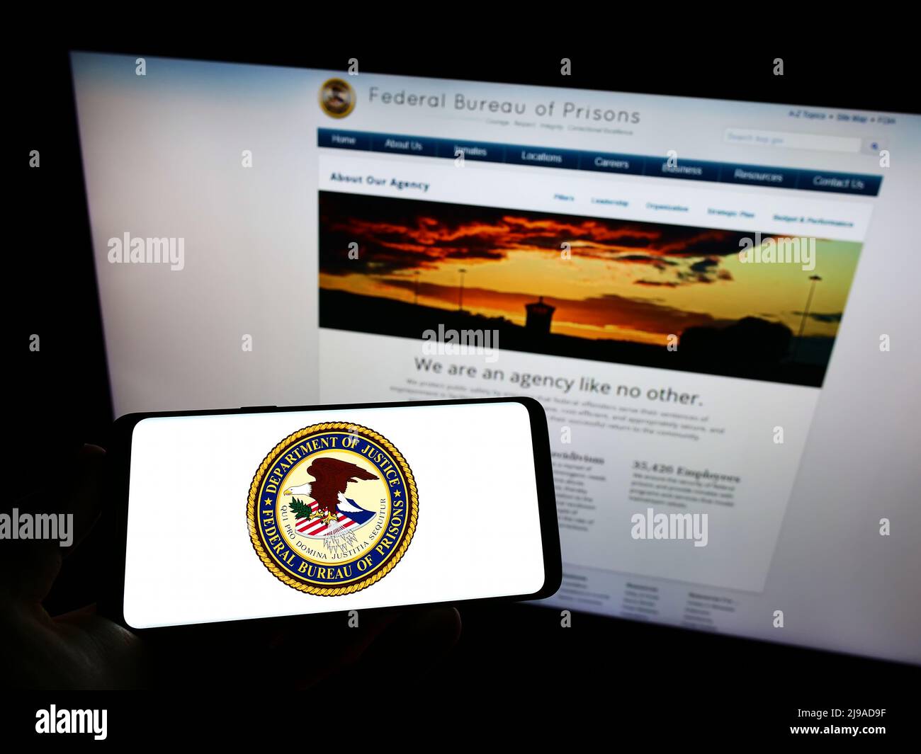 Person holding mobile phone with seal of US agency Federal Bureau of  Prisons (BOP) on screen in front of web page. Focus on phone display Stock  Photo - Alamy