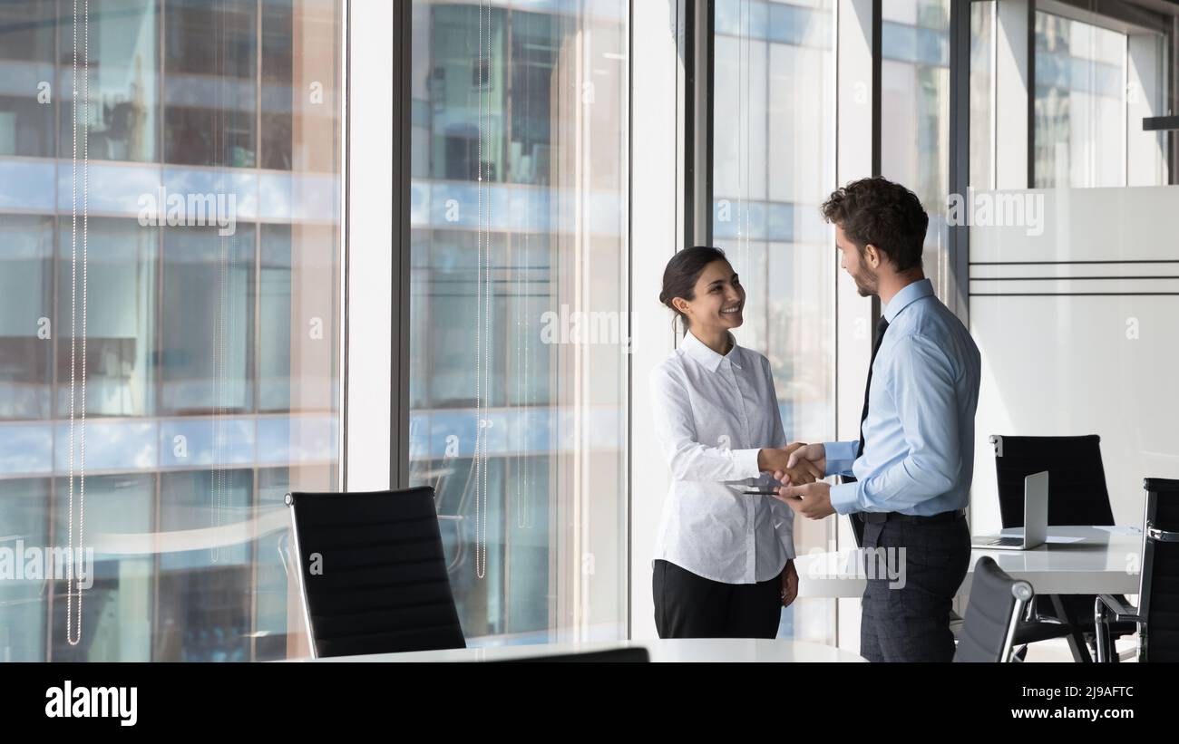 Multi ethnic client and manager make deal handshaking express respect Stock Photo Alamy