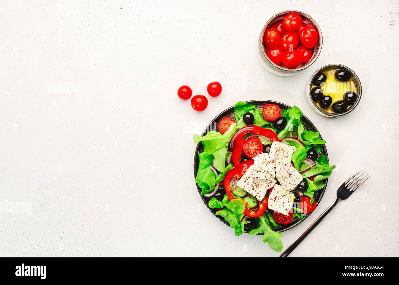 Greek salad with feta cheese, olives, cherry tomato, paprika, cucumber