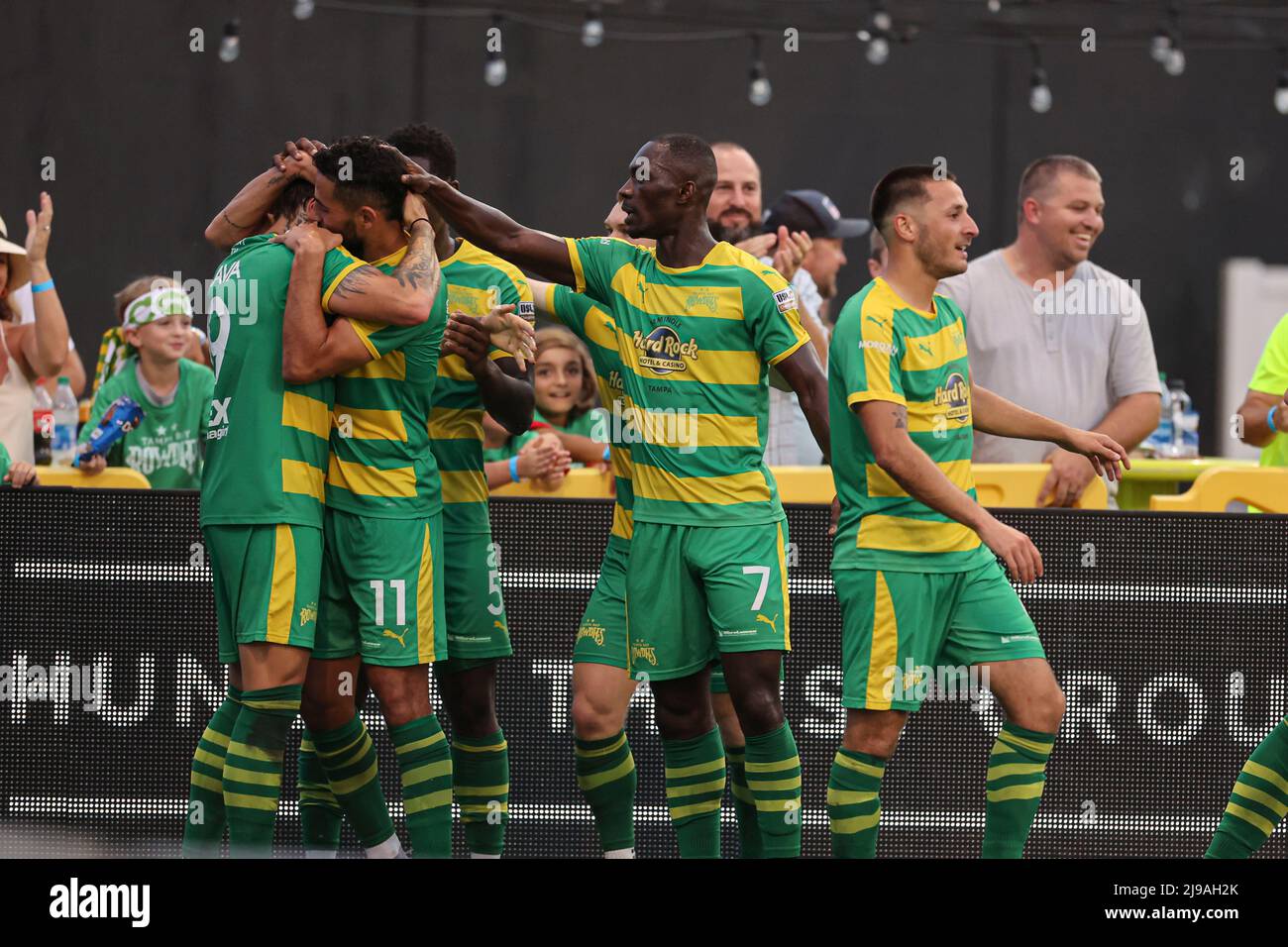 St. Petersburg, FL: Tampa Bay Rowdies midfielders Leo Fernandes (11) Yann Ekra (7) and Jake Areman (8) and  defender Jordan Scarlett (5) celebrate the Stock Photo