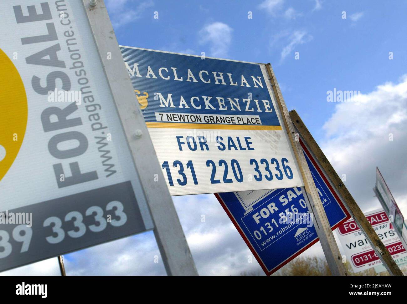 File photo dated 05/05/06 of for sale signs outside homes in a street in Loanhead near Edinburgh. Home ownership is now a 'distant dream' for many Scots as house prices soar against stagnating wage rises, Labour has said.Issue date: Sunday May 22, 2022. Stock Photo