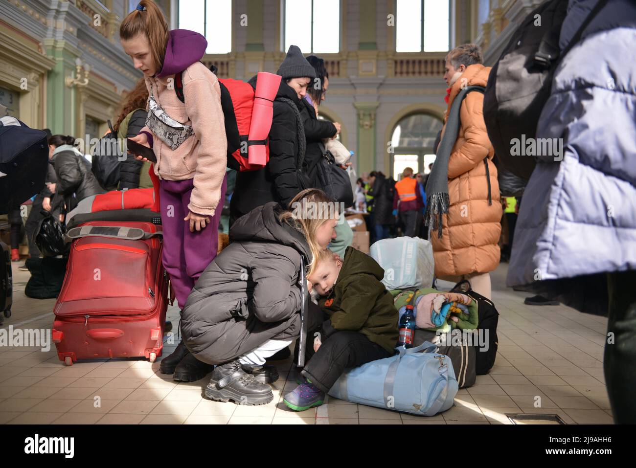 Refugees from Ukraine arrive at the train station in Przemysl, Poland, on the 20th day of the Russian invasion of their country. Stock Photo