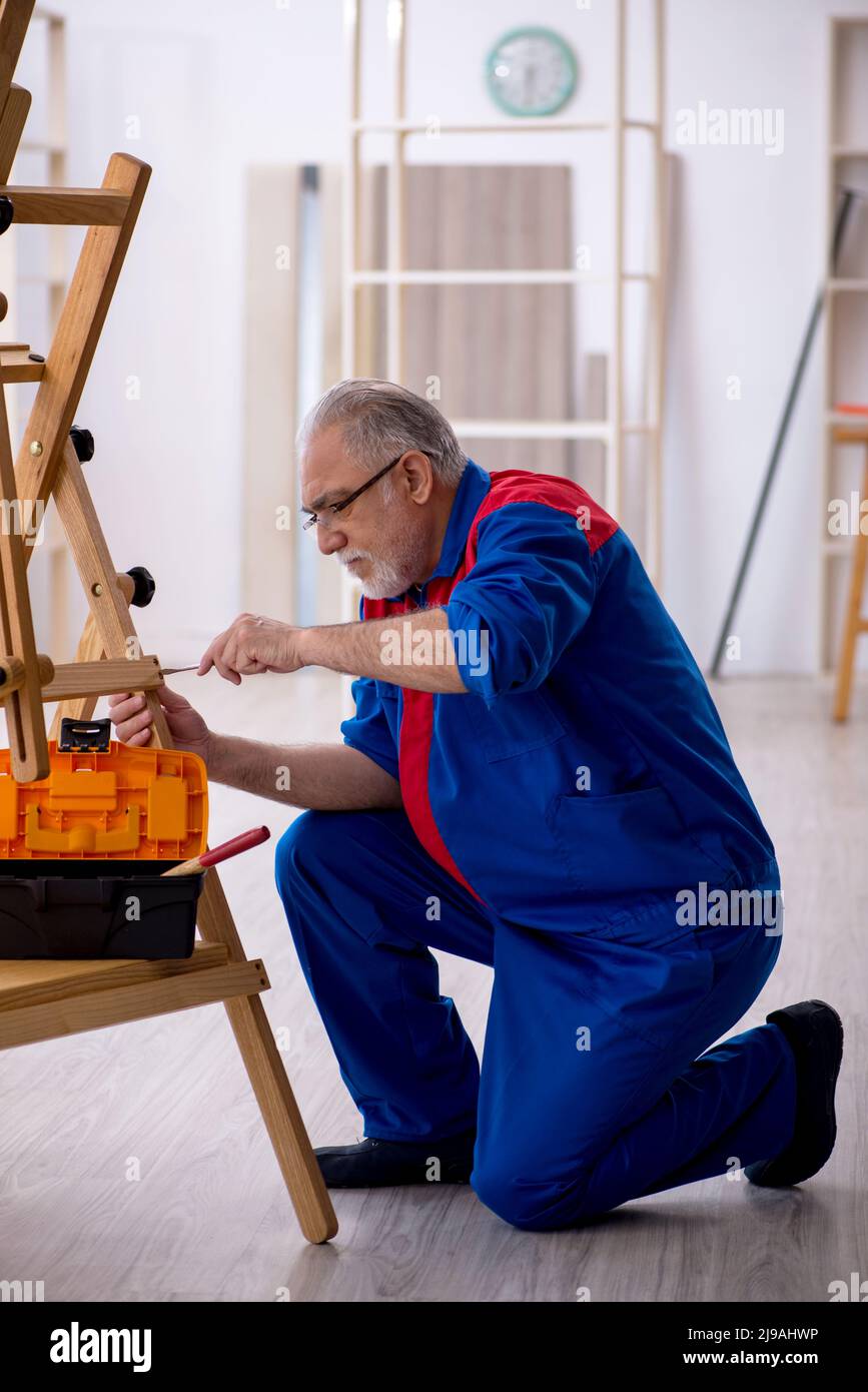 Repairing Draw Old carpenter repairing drawing easel Stock Photo - Alamy