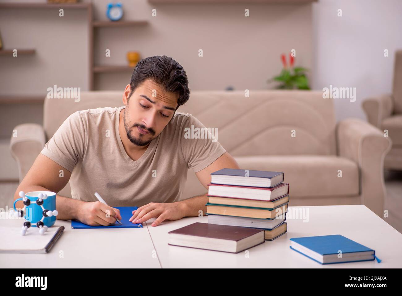 Young student studying at home during pandemic Stock Photo - Alamy