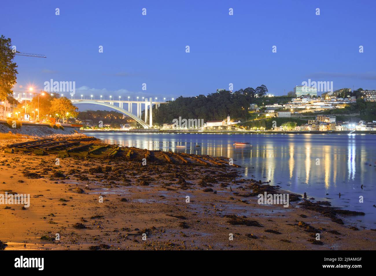 Arrabida Bridge in Porto at dusk Stock Photo