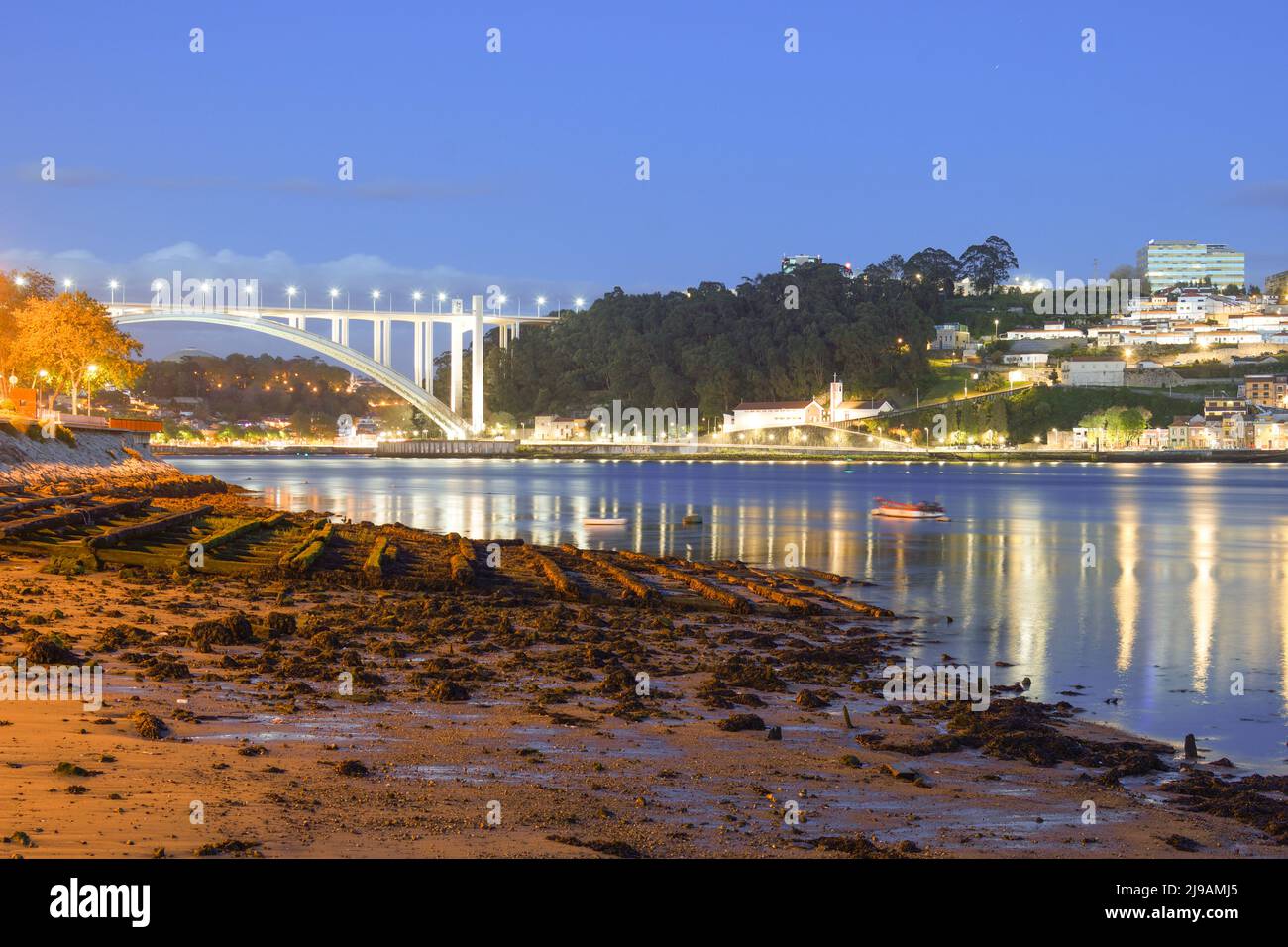 Arrabida Bridge in Porto at dusk Stock Photo