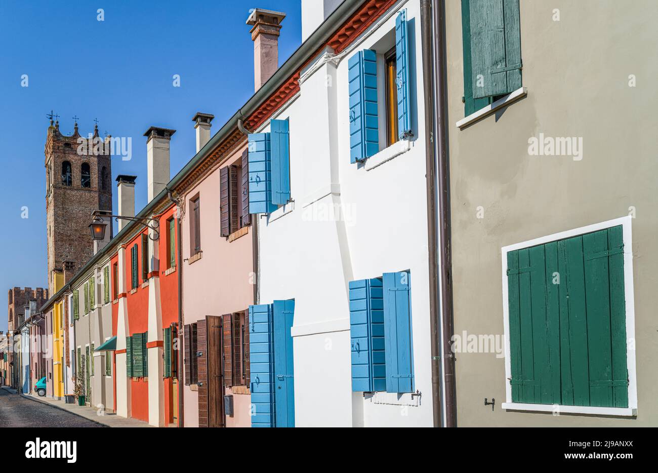 Italy, Montagnana,traditional colorful houses leaning against the ancient medieval walls that surround the town Stock Photo
