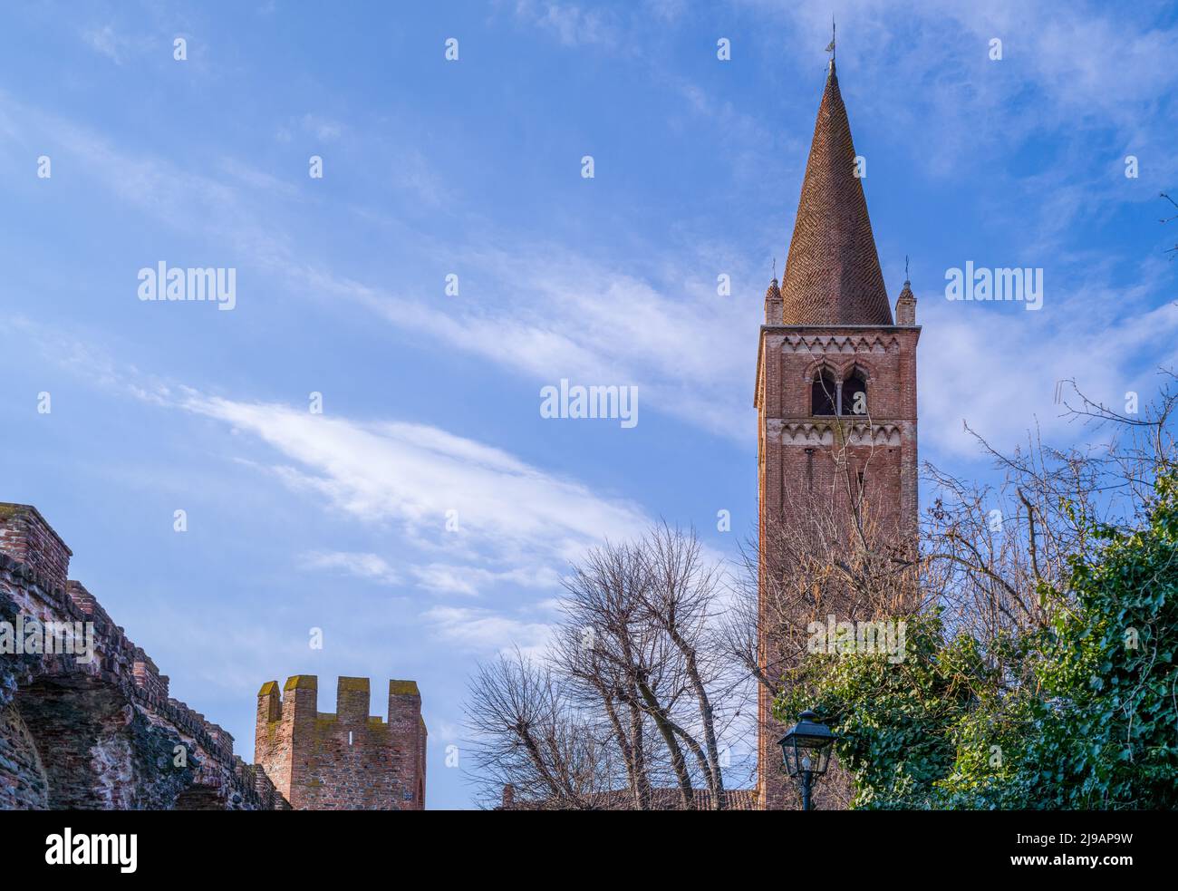 Italy, Montagnana, the church bell tower of San Francesco located in front of the medieval walls Stock Photo