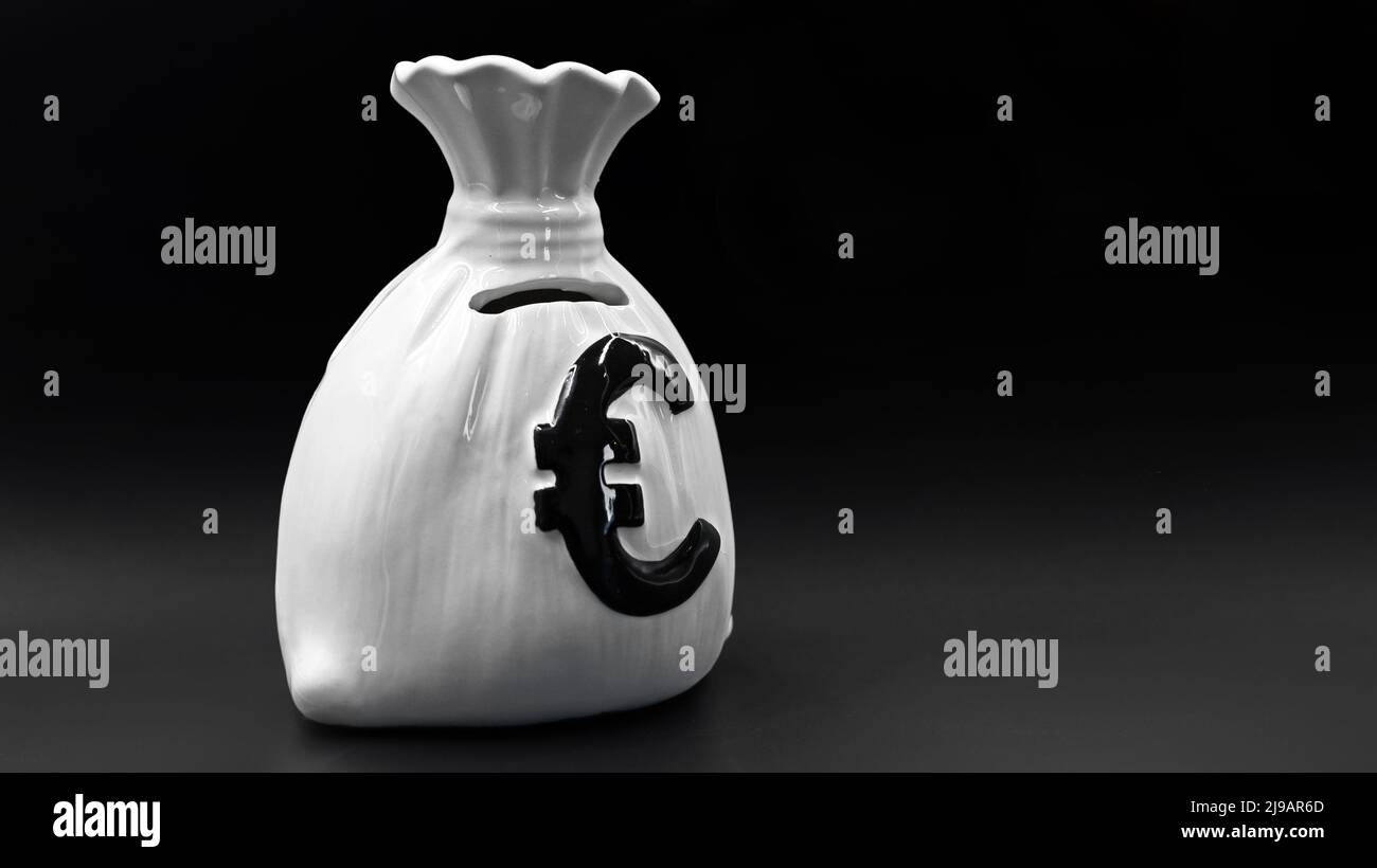 Porcelain money box in shape of a money bag with euro currency symbol
