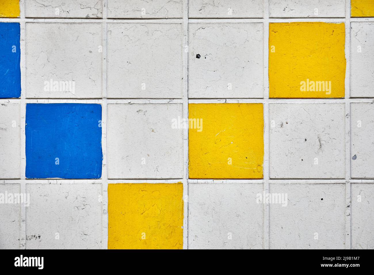 Tiled wall (white, yellow & blue) Stock Photo