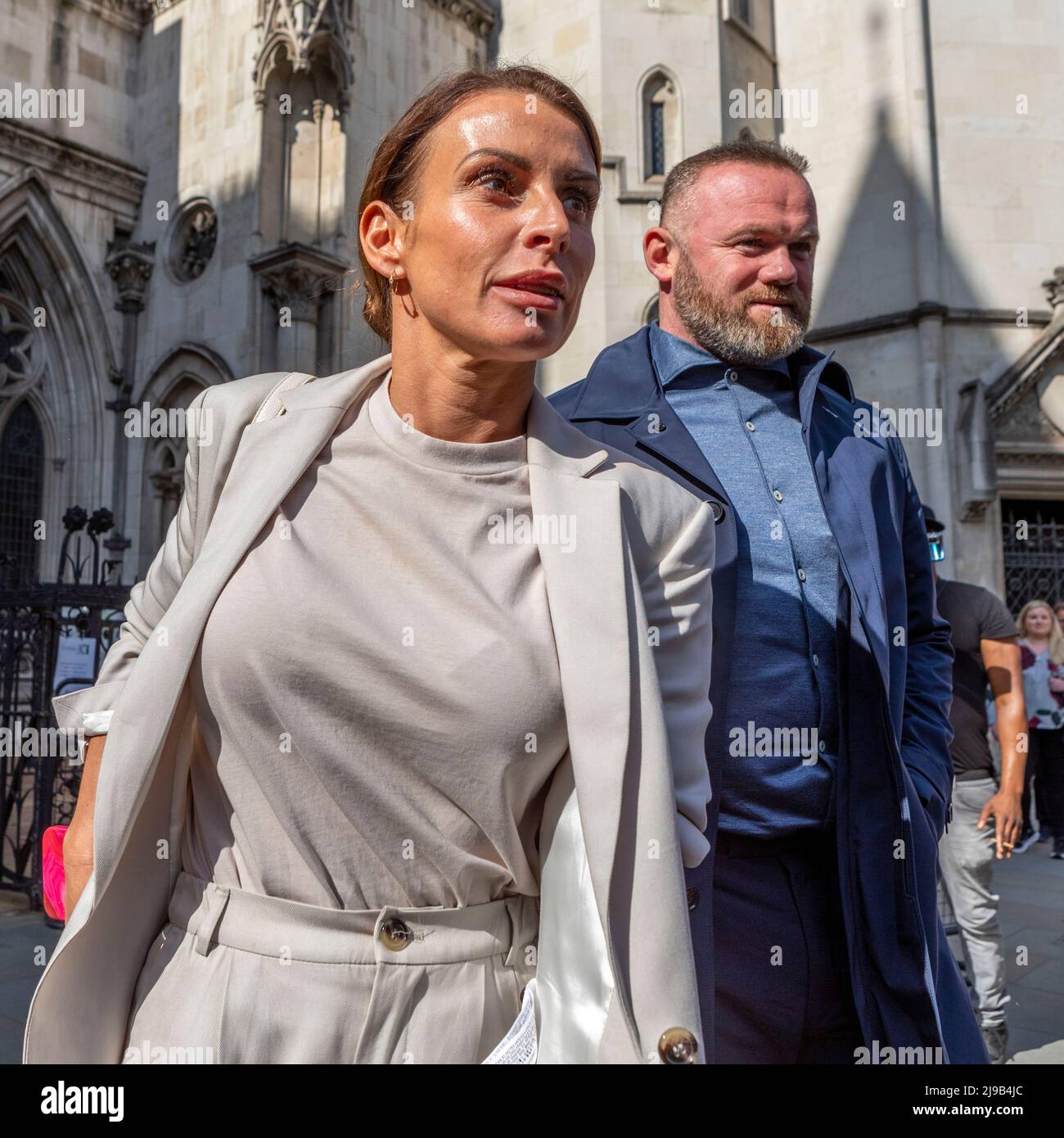 Coleen Rooney (L), accompanied by husband Wayne Rooney (R), leaves the Royal Courts of Justice after the fourth day of the ‘Wagatha Christie’ trial. Stock Photo