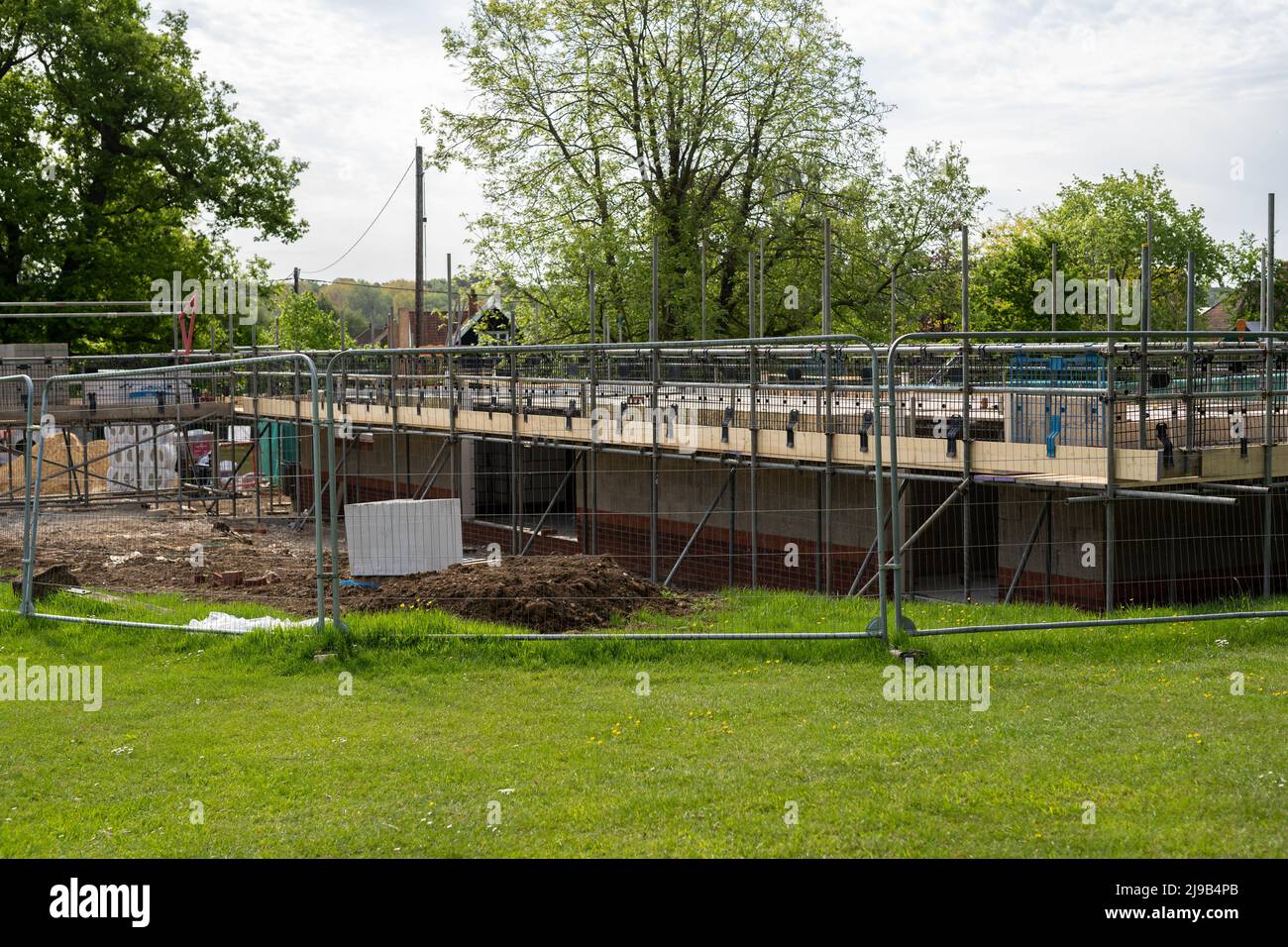 Woodbridge Suffolk UK May 17 2022: The start of a construction project, the foundations have been laid. Scaffolding has been put up and brickwork has Stock Photo