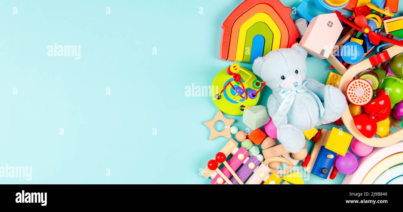 Baby kids toys on light blue background. Colorful educational wooden and  musical toys. Top view, flat lay Stock Photo - Alamy