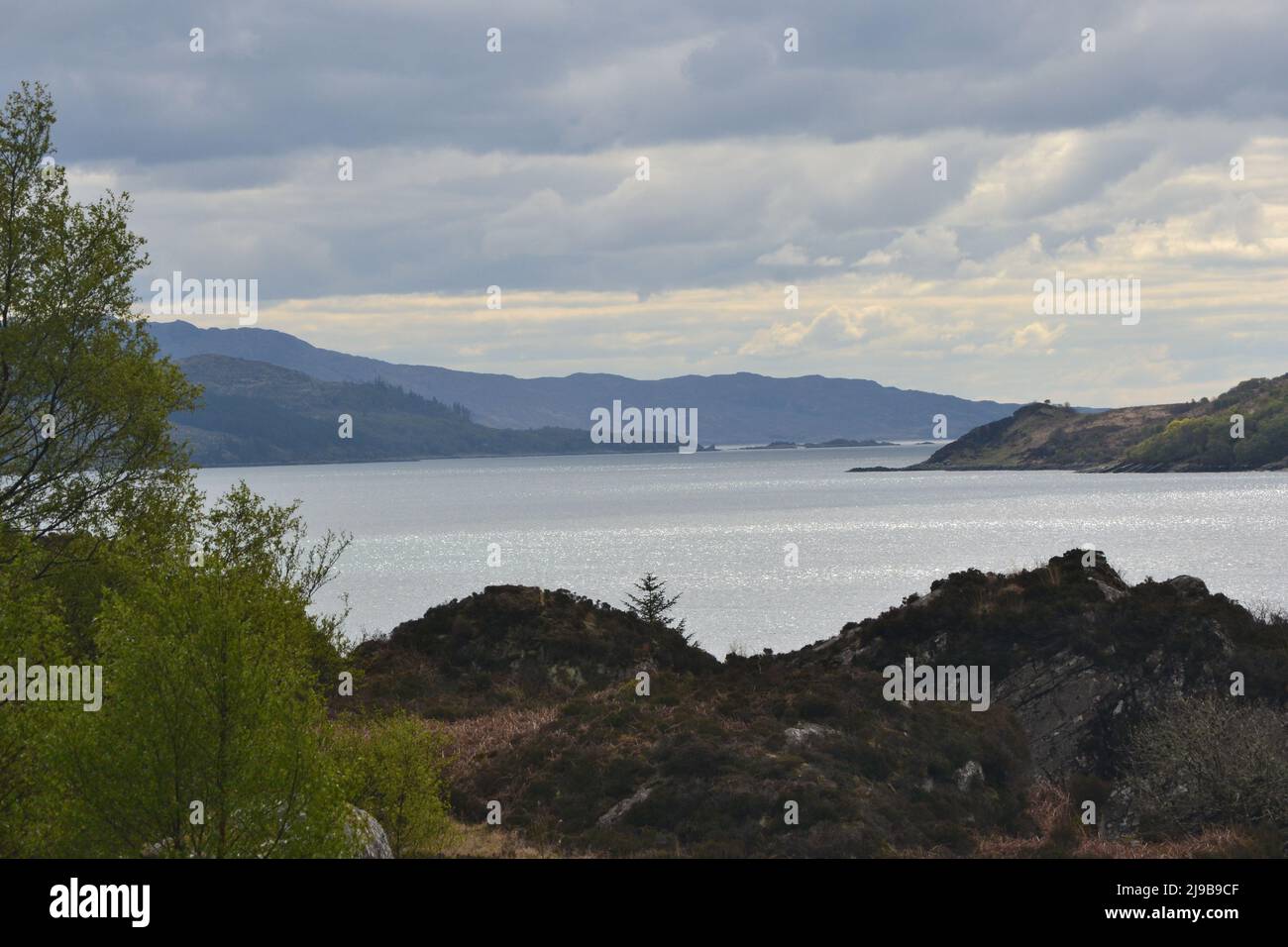 Photograph from the cafe at Glenelg ferry port over the Sound of Sleat towards the Isle of Skye. Stock Photo