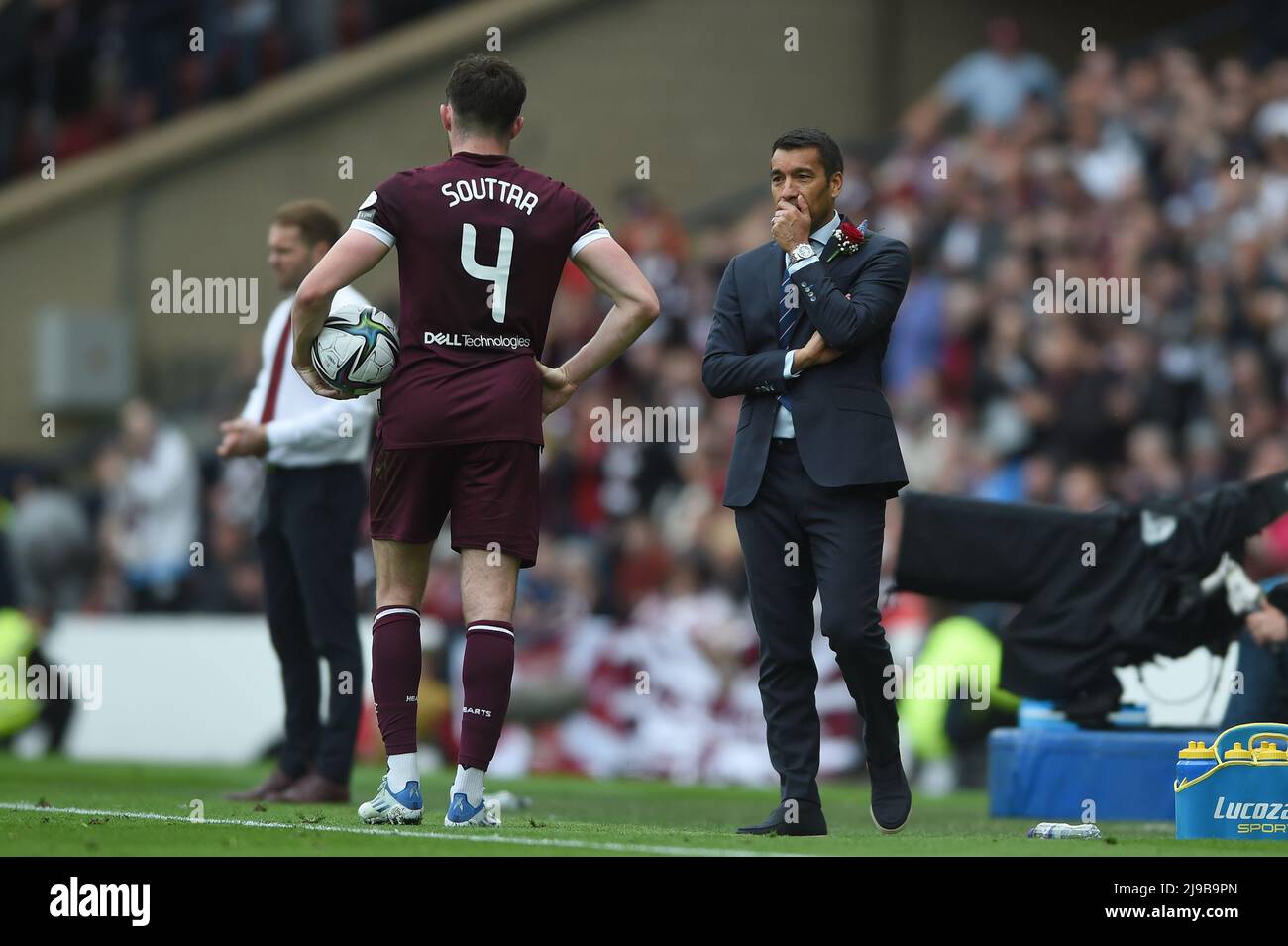 Glasgow, Scotland, 21st May 2022.  John Souttar of Hearts, who will join the Ibrox side next season chats with Rangers Manager Giovanni van Bronckhorst during the Scottish Cup match at Hampden Park, Glasgow. Picture credit should read: Neil Hanna / Sportimage Stock Photo