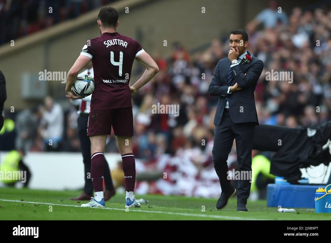 Glasgow, Scotland, 21st May 2022.  John Souttar of Hearts, who will join the Ibrox side next season chats with Rangers Manager Giovanni van Bronckhorst during the Scottish Cup match at Hampden Park, Glasgow. Picture credit should read: Neil Hanna / Sportimage Stock Photo